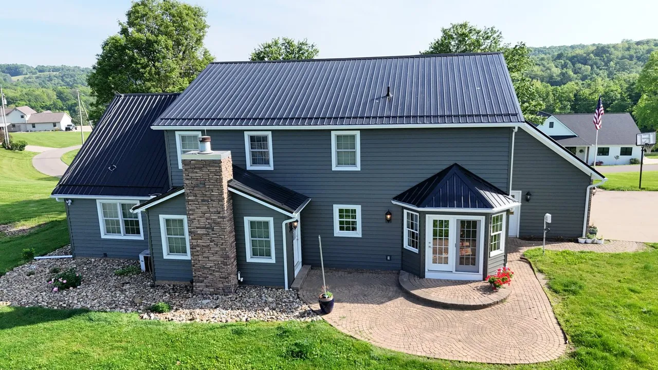 Dark metal roofing and exterior details — Pine Ridge Roofing project