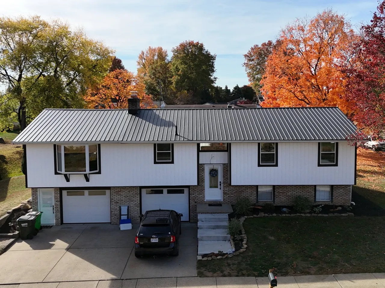 White board and batten siding — Pine Ridge Roofing project